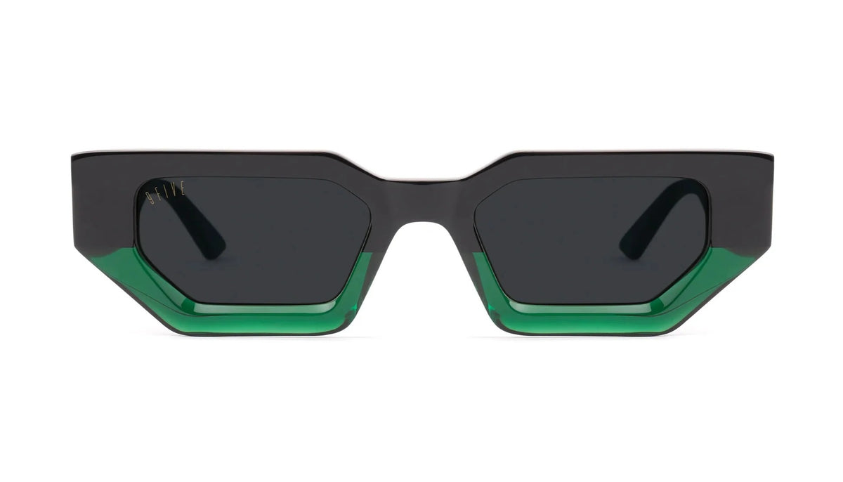 Geometric square sunglasses with a matte black frame and translucent green acetate detailing along the bottom edges of the lenses, shown against a plain white background.